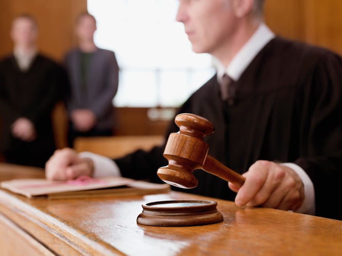 Fiduciaries and 403(b) Judge holding gavel in courtroom