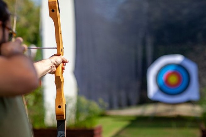 Archer taking aim signifying the importance of QDIA selection