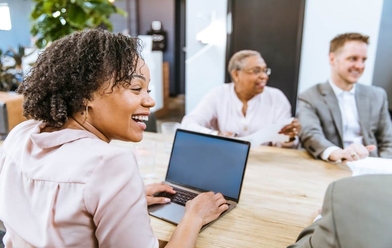 A woman is a retirement plan committee meeting