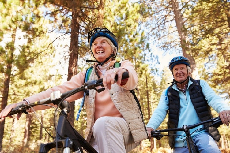 A retired couple enjoying a bike ride