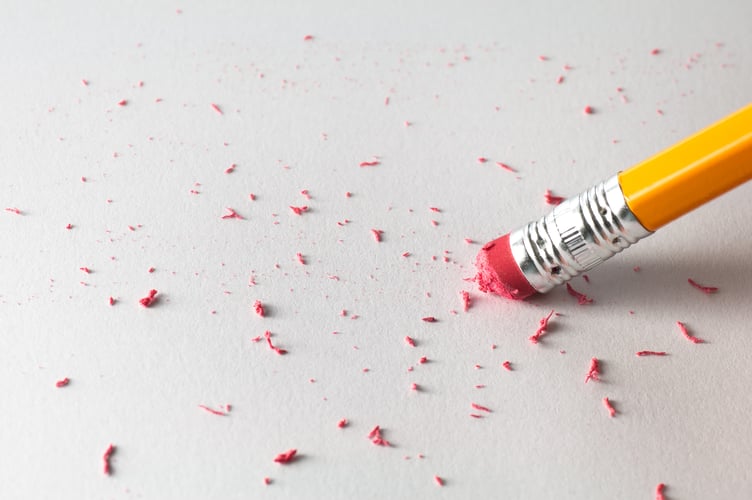 Pencil Erasing on White Paper