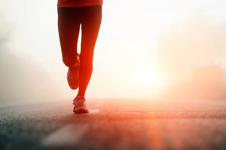 Runner sprinting towards financial wellness