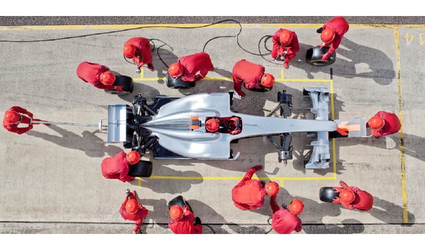 Open wheel racer pitting depicting how collective investment trusts been the vehicle for fast growth