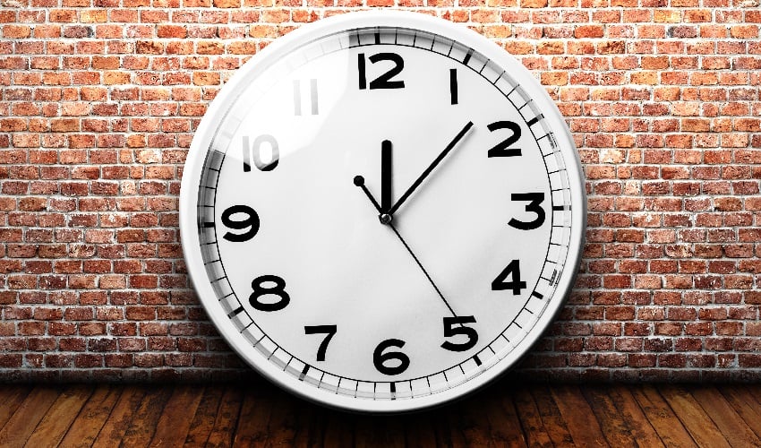 A Clock on a brick wall