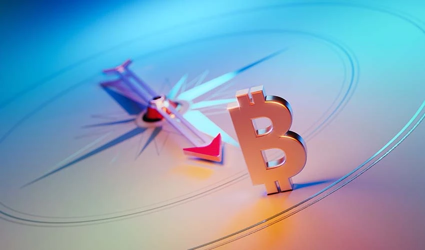 Compass pointing to a Bitcoin logo