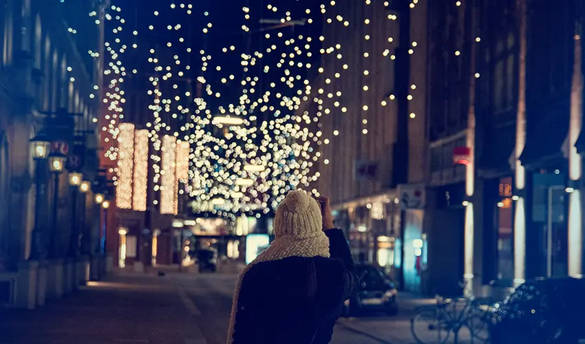 Woman looking at Christmas lights