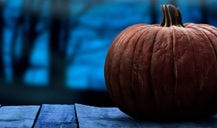 A pumpkin on a porch