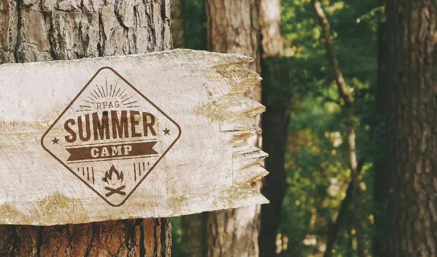 RPAG 2022 Summer Camp sign nailed onto a tree